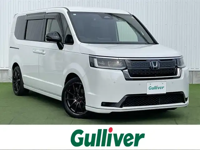 ホンダ ステップワゴン スパーダ eHEV プレミアムライン 香川県 2024(令6)年 2.4万km プラチナホワイトパール 登録時走行距離：23943km/純正SDナビゲーション/→CD/DVD再生/→フルセグTV/全方位カメラ/ビルトインETC2.0 /ステアリングリモコン/レーダークルーズコントロール/シートヒーター（1・2列目）/パワーシート/オートハイビーム/LEDオートライト/フォグランプ/電格ウィンカーミラー/レーンキープアシスト/横滑り防止装置/スマートキー/スペアキー