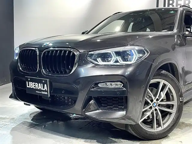 ＢＭＷ Ｘ３ xDrive20d Mスポーツ 道央・札幌 2018(平30)年 2.3万km ソフィスト・グレー・ブリリアント・エフェクト ドライビング・アシスト・プラス/・ACC/・ステアリング＆レーン・コントロール・アシスト/・アクティブ・サイド・コリジョン・プロテクション/・レーン・ディパーチャー・ウォーニング/・レーン・チェンジ・ウォーニング/・後車衝突警告機能/・クロス・トラフィック・ウォーニング/・前車接近警告機能/・衝突回避・被害軽減ブレーキ/19インチ・Mライト・アロイホイール・ダブルスポーク・スタイリング/黒革レザーシート/パワーシート（D/N）/メモリー付パワーシート（D）/シートヒーター（前席・後席）/パーキング・アシスト・プラス/アダプティブLEDヘッドライト/オートライト/ワイヤレスチャージング/純正ドライブレコーダー/テールゲート/レインセンサー/ETC/・保証書、取扱説明書（有）/・スペアキー×１