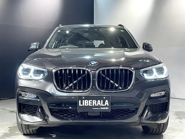 ＢＭＷ Ｘ３ xDrive20d Mスポーツ 道央・札幌 2018(平30)年 2.3万km ソフィスト・グレー・ブリリアント・エフェクト ドライビング・アシスト・プラス/・ACC/・ステアリング＆レーン・コントロール・アシスト/・アクティブ・サイド・コリジョン・プロテクション/・レーン・ディパーチャー・ウォーニング/・レーン・チェンジ・ウォーニング/・後車衝突警告機能/・クロス・トラフィック・ウォーニング/・前車接近警告機能/・衝突回避・被害軽減ブレーキ/19インチ・Mライト・アロイホイール・ダブルスポーク・スタイリング/黒革レザーシート/パワーシート（D/N）/メモリー付パワーシート（D）/シートヒーター（前席・後席）/パーキング・アシスト・プラス/アダプティブLEDヘッドライト/オートライト/ワイヤレスチャージング/純正ドライブレコーダー/テールゲート/レインセンサー/ETC/・保証書、取扱説明書（有）/・スペアキー×１