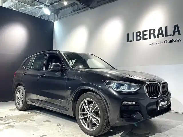 ＢＭＷ Ｘ３ xDrive20d Mスポーツ 道央・札幌 2018(平30)年 2.3万km ソフィスト・グレー・ブリリアント・エフェクト ドライビング・アシスト・プラス/・ACC/・ステアリング＆レーン・コントロール・アシスト/・アクティブ・サイド・コリジョン・プロテクション/・レーン・ディパーチャー・ウォーニング/・レーン・チェンジ・ウォーニング/・後車衝突警告機能/・クロス・トラフィック・ウォーニング/・前車接近警告機能/・衝突回避・被害軽減ブレーキ/19インチ・Mライト・アロイホイール・ダブルスポーク・スタイリング/黒革レザーシート/パワーシート（D/N）/メモリー付パワーシート（D）/シートヒーター（前席・後席）/パーキング・アシスト・プラス/アダプティブLEDヘッドライト/オートライト/ワイヤレスチャージング/純正ドライブレコーダー/テールゲート/レインセンサー/ETC/・保証書、取扱説明書（有）/・スペアキー×１