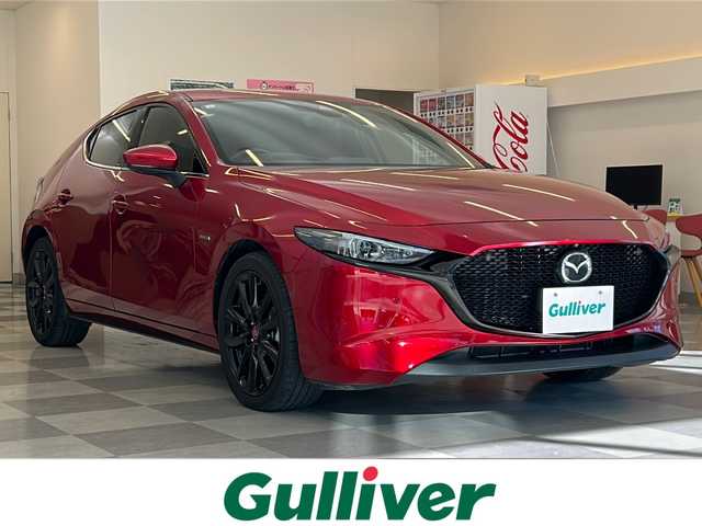 マツダ マツダ３ファストバック 20S 100周年特別記念車 岐阜県 2020(令2)年 6.3万km ソウルレッドクリスタルM 2020WCDOTY受賞記念モデル/BOSEサウンドシステム/全方位カメラ/純正ナビゲーション/フルセグテレビ/Bluetooth/CD/DVD再生/USB接続/HDMI/ETC/前後純正ドライブレコーダー/MRCC(マツダレーダークルーズコントロール)/クリアランスソナー/ブラインドスポットモニター/革シート/シートメモリー/シートヒーター/ステアリングヒーター/パドルシフト/ヘッドアップディスプレイ/電動パーキング/ブレーキホールド/アイドリングストップ/横滑り防止装置/リアウィンドウデフォッガー/プッシュスタート/スマートキー/オートライト/オートマチックハイビーム/LEDヘッドライト/純正18インチアルミホイール