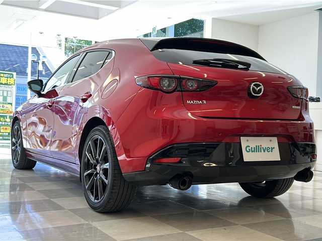 マツダ マツダ３ファストバック 20S 100周年特別記念車 岐阜県 2020(令2)年 6.3万km ソウルレッドクリスタルM 2020WCDOTY受賞記念モデル/BOSEサウンドシステム/全方位カメラ/純正ナビゲーション/フルセグテレビ/Bluetooth/CD/DVD再生/USB接続/HDMI/ETC/前後純正ドライブレコーダー/MRCC(マツダレーダークルーズコントロール)/クリアランスソナー/ブラインドスポットモニター/革シート/シートメモリー/シートヒーター/ステアリングヒーター/パドルシフト/ヘッドアップディスプレイ/電動パーキング/ブレーキホールド/アイドリングストップ/横滑り防止装置/リアウィンドウデフォッガー/プッシュスタート/スマートキー/オートライト/オートマチックハイビーム/LEDヘッドライト/純正18インチアルミホイール