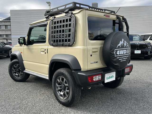 スズキ ジムニー シエラ JC 東京都 2024(令6)年 0.9万km シフォンアイボリーM ワンオーナー/４WD/モニター付DVD/CD/USBプレイヤー/【PVH-9300DVSZS】/ETC　Fドライブレコーダー/シートヒーター/クルーズコントロール/衝突軽減ブレーキ/レーンキープアシスト/LEDヘッドライト/スマートキー×２/ルーフキャリアー/リヤ/サイドラダー/サイドラックテーブル/セカンドサイドテーブル/EXEA/LEDシフトゲートパネル/ドアグリップポケットベース/スマホホルダータフネス/ドリンクホルダー/純正15インチアルミ