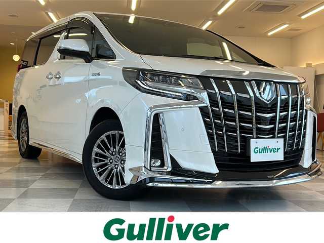 トヨタ アルファードハイブリット エグゼクティブ ラウンジ S 岐阜県 2019(平31)年 2.4万km ホワイトパールクリスタルシャイン モデリスタフルエアロ/ツインムーンルーフ/ＪＢＬサウンド/リアエンターテイメント/純正9型ナビ/後席モニター/デジタルインナーミラー/フルセグ視聴/３眼LEDヘッドライト/４WD/ドライブレコーダー/パワーバックドア/シートヒーター2列目あり/エアシート2列目あり/メモリーシート2列目あり/両側電動スライドア/ETC2.0/マフラーカッター/３眼LEDヘッドライト/プリクラッシュセーフティ/ブラインドスポットモニター/プッシュスタート/スマートキー/スペアキー/取扱説明書・記録簿