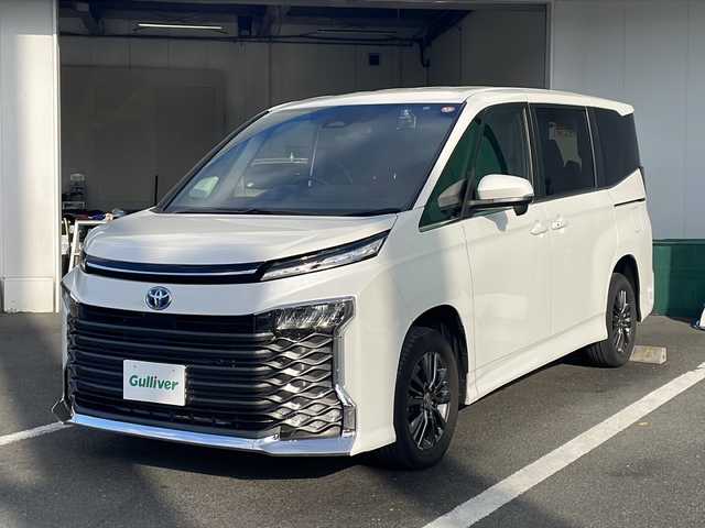 トヨタ ヴォクシー ハイブリッド S－Z 京都府 2022(令4)年 4.9万km ホワイトパールクリスタルシャイン 純正１０インチディスプレイオーディオ　ナビ　フルセグ　Ｂｌｕｅｔｏｏｔｈオーディオ　バックカメラ　後席フリップダウンモニター　レーダークルーズ　両側パワースライド　ＬＥＤライト　シートヒーター　前後ドラレコ　クリアランスソナー　ビルトインETC