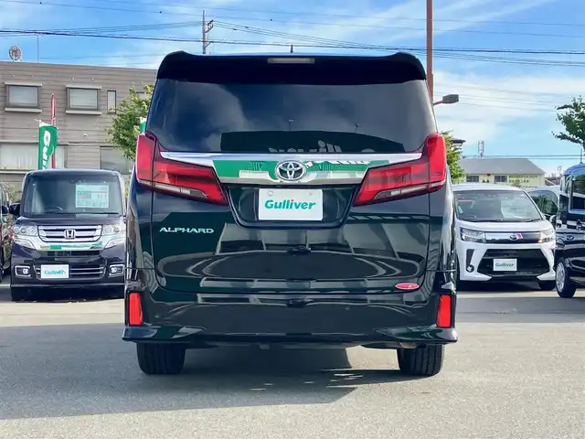トヨタ アルファード S タイプゴールド 静岡県 2020(令2)年 5.1万km ブラック エンジンスタートボタン/パワーステアリング/パワーウィンドウ/100V充電/スマートキー/スペアキー/Wオートエアコン/クルーズコントロール/純正フリップダウンモニター/USB入力端子/ETC2.0/バックカメラ/純正ナビ（CD/DVD/BT/フルセグ）/三列シート/オットマン/電動リアゲート/ドライブレコーダー前後/ウォークスルー/純正フロアマット/ハーフレザー/両側パワースライドドア/モデリスタエアロ（フロント）/純正アルミホイール/ABS/横滑り防止装置/コーナーセンサー前後/レーンキープアシスト/盗難防止装置/オートライト/オートマチックハイビーム/三眼LEDヘッドライト/W＋サイドエアバック/衝突軽減システム/カーテンエアバック