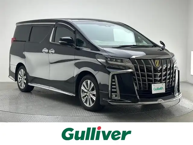 トヨタ アルファード S タイプゴールド 兵庫県 2020(令2)年 5.1万km ブラック エンジンスタートボタン/パワーステアリング/パワーウィンドウ/100V充電/スマートキー/スペアキー/Wオートエアコン/クルーズコントロール/純正フリップダウンモニター/USB入力端子/ETC2.0/バックカメラ/純正ナビ（CD/DVD/BT/フルセグ）/三列シート/オットマン/電動リアゲート/ドライブレコーダー前後/ウォークスルー/純正フロアマット/ハーフレザー/両側パワースライドドア/モデリスタエアロ（フロント）/純正アルミホイール/ABS/横滑り防止装置/コーナーセンサー前後/レーンキープアシスト/盗難防止装置/オートライト/オートマチックハイビーム/三眼LEDヘッドライト/W＋サイドエアバック/衝突軽減システム/カーテンエアバック