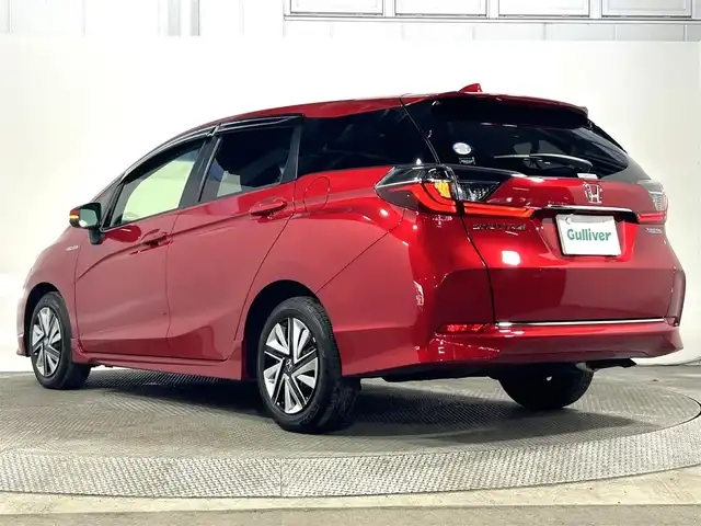 ホンダ シャトル ハイブリッド X ホンダセンシング 大阪府 2019(令1)年 2.2万km プレミアムクリスタルレッドM 純正ナビ(フルセグ/DVD再生/Bluetooth) バックカメラ ETC ハーフレザー シートヒーター 衝突軽減 レーダークルコン パドルシフト オートライト スマートキー ドラレコ