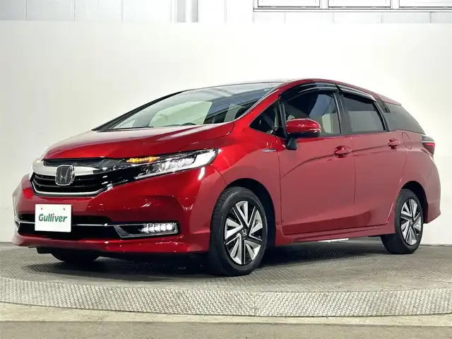 ホンダ シャトル ハイブリッド X ホンダセンシング 大阪府 2019(令1)年 2.2万km プレミアムクリスタルレッドM 純正ナビ(フルセグ/DVD再生/Bluetooth) バックカメラ ETC ハーフレザー シートヒーター 衝突軽減 レーダークルコン パドルシフト オートライト スマートキー ドラレコ