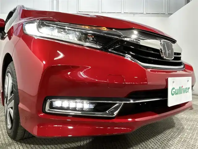 ホンダ シャトル ハイブリッド X ホンダセンシング 大阪府 2019(令1)年 2.2万km プレミアムクリスタルレッドM 純正ナビ(フルセグ/DVD再生/Bluetooth) バックカメラ ETC ハーフレザー シートヒーター 衝突軽減 レーダークルコン パドルシフト オートライト スマートキー ドラレコ