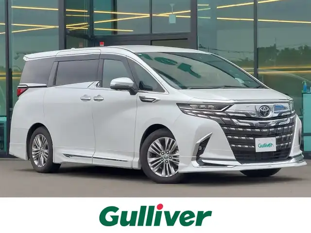 トヨタ アルファード Z 東京都 2024(令6)年 1.4万km プラチナホワイトパールマイカ モデリスタエアロ/ユニバーサルステップ/ヘッドアップディスプレイ/純正ディスプレイオーディオ/パノラミックビューモニター/フリップダウンモニター/AC100V/左右独立ムーンルーフ/デジタルインナーミラー/両側パワースライドドア/ビルトインETC2.0/シートヒーター/ベンチレーションシート/ステアリングヒーター/トヨタセーフティセンス/・プリクラッシュセーフティ/・レーントレーシングアシスト/・レーダークルーズコントロール/・アダプティブハイビームシステム/・ブラインドスポットモニター