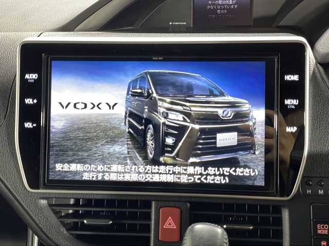 トヨタ ヴォクシー ZS 煌Ⅲ 広島県 2021(令3)年 2.8万km イナズマスパーキングブラックガラスフレーク 純正10型ナビ/両側パワースライドドア/バックカメラ/クリアランスソナー/クルーズコントロール/セーフティセンス/・プリクラッシュセーフティ/・レーンディパーチャーアラート/・オートマチックハイビーム/LEDヘッドランプ/純正16インチAW/ETC/ドライブレコーダー