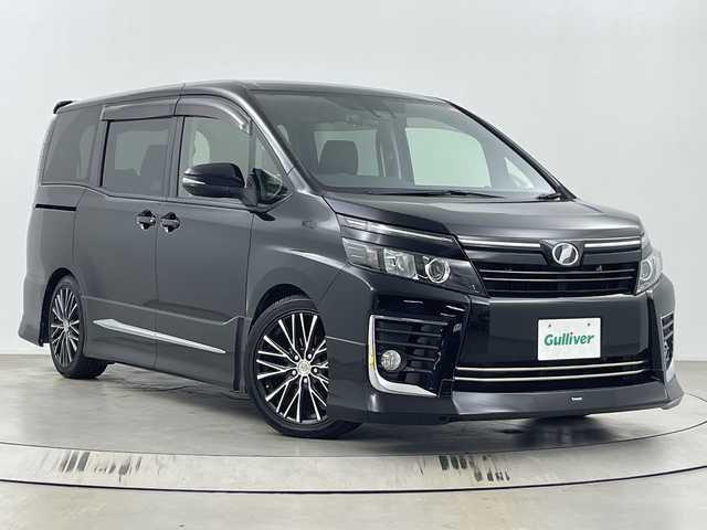 トヨタ ヴォクシー ZS 埼玉県 2017(平29)年 5.2万km ブラック フルモデリスタエアロ/社外フリップダウンモニター/社外11インチナビ　EX11V/(Bluetooth/CD/DVD/HDMI/USB/AM/FM)/地デジフルセグ/バックカメラ/前方ドライブレコーダー/ETC/車線逸脱警報/衝突軽減ブレーキ/オートマチックハイビーム/先行車発進お知らせ機能/ECOモード/ロールサンシェード/レーダー探知機　ZERO 702V/電動格納ミラー・ウィンカーミラー/フロントフォグランプ/プッシュスタート/ステアリングリモコン/社外フロアマット/純正ドアバイザー/社外18インチアルミホイール