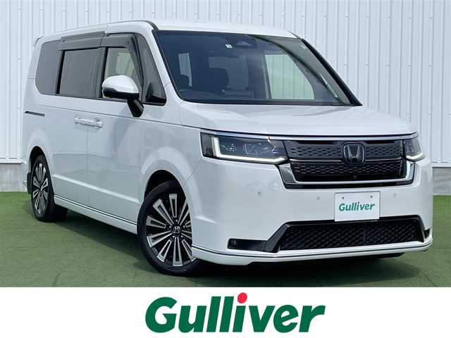 ホンダ ステップワゴン スパーダ eHEV プレミアムライン 香川県 2022(令4)年 3.8万km プラチナホワイトパール 登録時走行距離：37596km/純正11.4型ナビ/　CD DVD BT フルセグTV/全方位カメラ/前後ドライブレコーダー/ビルトインETC/両側パワースライドドア/パワーバックドア/衝突被害軽減装置/レーンキープアシスト/レーダークルーズコントロール/クリアランスソナー/ブラインドスポットモニター/LEDヘッドライト/オートライト/フォグランプ/ハーフレザーシート/シートヒーター/ロールサンシェード/ISOFIX/オーバーヘッドコンソール/革巻きステアリング/ステアリングスイッチ/パドルシフト/プッシュスタート/スマートキー