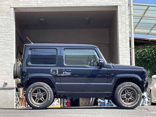 スズキ ジムニー XC 大分県 2025(令7)年 0.4万km ブルーイッシュブラックパール3 ワンオーナー /社外ディスプレイオーディオ/ブルートゥース/バックカメラ/社外バンパー/社外16インチアルミホイール/LEDヘッドライト/社外ETC/オートマッチックハイビーム/衝突被害軽減ブレーキ/スマートキー/プッシュスタート/アイドリングストップ/スペアキー/純正バンパー有り