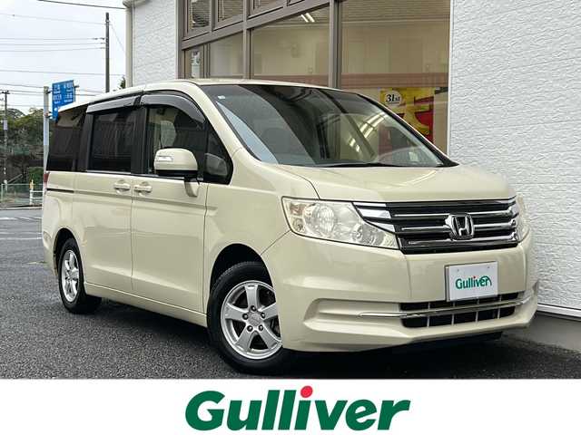 ホンダ ステップワゴン G コンフォートセレクション 山形県 2012(平24)年 5.4万km ヒダマリアイボリーパール 純正ナビ(CD/DVD/ワンセグ)/バックカメラ/ビルトインETC/社外アルミホイール/両側パワースライドドア/クルーズコントロール/純正フロアマット/アイドリングストップ/三列シート/ウォークスルーシート/盗難防止装置/横滑り防止装置/保証書/取扱説明書/スペアキー×１