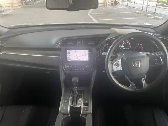 ホンダ シビック ハッチバック 大阪府 2019(令1)年 1.9万km クリスタルブラックパール ホンダセンシング/・衝突軽減ブレーキ/・路外逸脱抑制機能/・アクティブクルーズコントロール/・車線維持支援システム/・オートハイビーム/・標識認識機能/ホンダ純正メモリナビ/・Bluetooth/・バックカメラ/・CD・DVD/ホンダ純正18アルミホイール/パドルシフト/運転席＆助手席シートヒーター/マルチインフォメーションディスプレイ/オートブレーキホールド機能/電子制御パーキングブレーキ/エンジンスタート付Ｈｏｎｄａスマートキー/ワンオーナー/新車保証書/取扱説明書