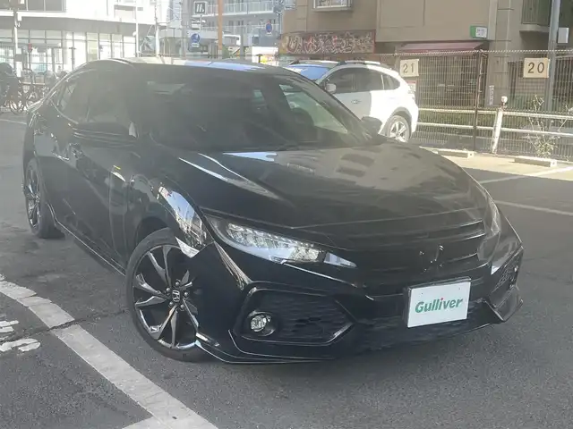 ホンダ シビック ハッチバック 大阪府 2019(令1)年 1.9万km クリスタルブラックパール ホンダセンシング/・衝突軽減ブレーキ/・路外逸脱抑制機能/・アクティブクルーズコントロール/・車線維持支援システム/・オートハイビーム/・標識認識機能/ホンダ純正メモリナビ/・Bluetooth/・バックカメラ/・CD・DVD/ホンダ純正18アルミホイール/パドルシフト/運転席＆助手席シートヒーター/マルチインフォメーションディスプレイ/オートブレーキホールド機能/電子制御パーキングブレーキ/エンジンスタート付Ｈｏｎｄａスマートキー/ワンオーナー/新車保証書/取扱説明書