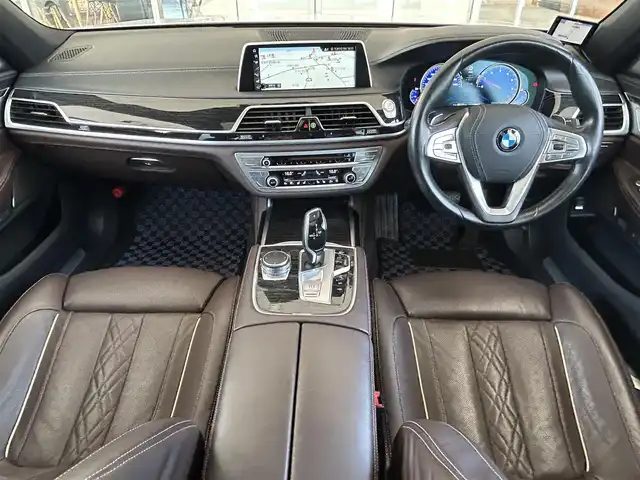 ＢＭＷ ７５０Ｌｉ Mスポーツ 茨城県 2017(平29)年 6.6万km ミネラルホワイト インテリジェントS/コンフォートA/スカイラウンジパノラマガラスサンルーフ/harman/kardon/ジェスチャーコントロール/Mスポーツエキゾースト/ブラウンレザーシート/リアモニター/純正ナビ/フルセグTV/360°カメラ/ミラー一体型ETC/全席パワーシート/全席シートヒーター/全席ベンチレーション/HUD/社外18インチAW