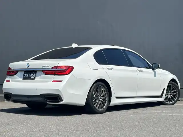 ＢＭＷ ７５０Ｌｉ Mスポーツ 茨城県 2017(平29)年 6.6万km ミネラルホワイト インテリジェントS/コンフォートA/スカイラウンジパノラマガラスサンルーフ/harman/kardon/ジェスチャーコントロール/Mスポーツエキゾースト/ブラウンレザーシート/リアモニター/純正ナビ/フルセグTV/360°カメラ/ミラー一体型ETC/全席パワーシート/全席シートヒーター/全席ベンチレーション/HUD/社外18インチAW