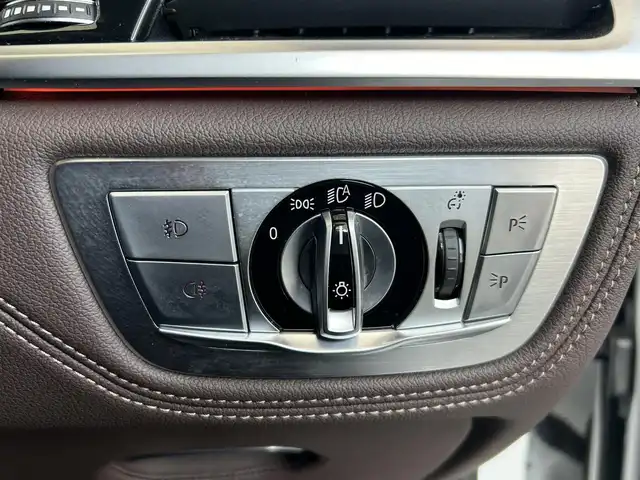 ＢＭＷ ７５０Ｌｉ Mスポーツ 茨城県 2017(平29)年 6.6万km ミネラルホワイト インテリジェントS/コンフォートA/スカイラウンジパノラマガラスサンルーフ/harman/kardon/ジェスチャーコントロール/Mスポーツエキゾースト/ブラウンレザーシート/リアモニター/純正ナビ/フルセグTV/360°カメラ/ミラー一体型ETC/全席パワーシート/全席シートヒーター/全席ベンチレーション/HUD/社外18インチAW