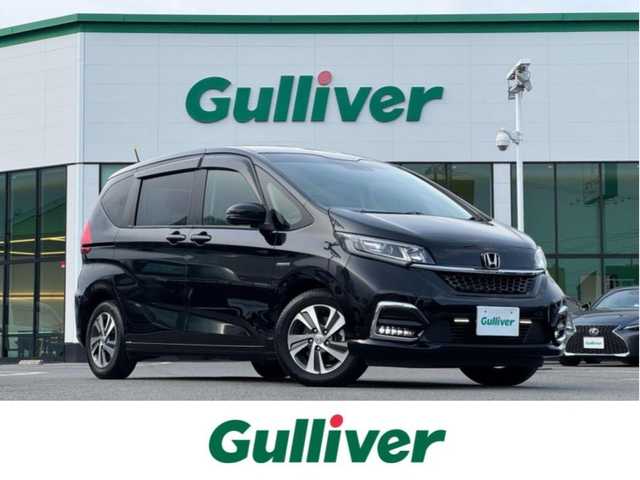 ホンダ フリード ハイブリット G ホンダセンシング 愛媛県 2020(令2)年 6.4万km クリスタルブラックパール ホンダセンシング/プッシュスタート/純正8インチナビ（CD/DVD/フルセグTV/Bluetooth/SD)/バックカメラ/ETC/両側パワースライドドア/オートライト/スマートキー/LEDヘッドライト/純正アルミホイール