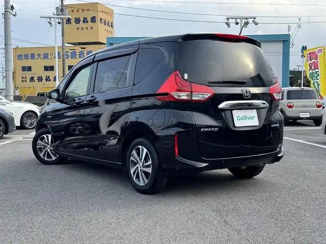 ホンダ フリード ハイブリット G ホンダセンシング 愛媛県 2020(令2)年 6.4万km クリスタルブラックパール ホンダセンシング/プッシュスタート/純正8インチナビ（CD/DVD/フルセグTV/Bluetooth/SD)/バックカメラ/ETC/両側パワースライドドア/オートライト/スマートキー/LEDヘッドライト/純正アルミホイール
