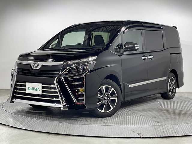 トヨタ ヴォクシー ZS 煌Ⅱ 広島県 2019(令1)年 6万km ブラック 禁煙車/ＡＬＰＩＮＥ１１型ナビ/１２．８型後席フリップダウンモニター/バックカメラ/両側パワースライドドア/クルーズコントロール/ＨＤＭＩ/オートマチックハイビーム/ＥＴＣ/ＭＴモード付ＡＴシフト/ＬＥＤヘッドライト/衝突被害軽減/レーンキープアシスト/踏み間違い防止/純正16インチアルミホイール(205/60/R16)/エアバッグ(運転席/助手席)
