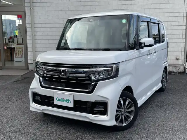 ホンダ Ｎ ＢＯＸ カスタム L 大分県 2021(令3)年 2.1万km プラチナホワイトパール 〇純正メモリーナビ/　CD/DVD/フルセグ/BT/USB/〇バックカメラ/〇クリアランスソナー/〇横滑り防止/〇LKA/〇ホンダセンシング/〇ACC/〇ヘッドライトレベライザー/〇片側パワースライドドア/〇ステアリングスイッチ/〇フロアマット/〇ドアバイザー/〇プライバシーガラス/〇ウインカーミラー/〇ドライブレコーダー/〇保証書/〇取扱説明書/〇スペアキー