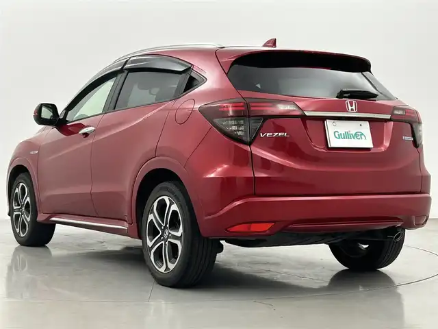 ホンダ ヴェゼル ハイブリッド Z ホンダセンシング 熊本県 2018(平30)年 4.9万km プレミアムクリスタルレッドM ワンオーナー/純正メモリーナビ（VXM-187VFEi)/（CD/DVD/Bluetooth/フルセグTV)/バックカメラ/ビルトインETC/ホンダセンシング/・CMBS/・レーンキープアシスト/・路外逸脱抑制システム/・先行車発進お知らせ/・標識認識機能/・アダプティブクルーズコントロール/ハーフレザーシート/前席シートヒーター/電動パーキングブレーキ/ブレーキホールド/パドルシフト/ステアリングスイッチ/純正１７インチアルミホイール/保証書/取扱説明書