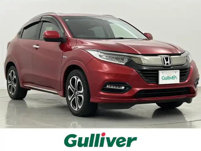 ホンダ ヴェゼル ハイブリッド Z ホンダセンシング 熊本県 2018(平30)年 4.9万km プレミアムクリスタルレッドM ワンオーナー/純正メモリーナビ（VXM-187VFEi)/（CD/DVD/Bluetooth/フルセグTV)/バックカメラ/ビルトインETC/ホンダセンシング/・CMBS/・レーンキープアシスト/・路外逸脱抑制システム/・先行車発進お知らせ/・標識認識機能/・アダプティブクルーズコントロール/ハーフレザーシート/前席シートヒーター/電動パーキングブレーキ/ブレーキホールド/パドルシフト/ステアリングスイッチ/純正１７インチアルミホイール/保証書/取扱説明書