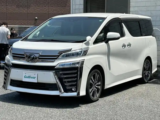 トヨタ ヴェルファイア Z Gエディション 福岡県 2019(令1)年 4万km ホワイトパールクリスタルシャイン ワンオーナー/純正10インチSDナビ【NSZN-Z68T】/(AM/FM/CD/DVD/Bluetooth/フルセグTV)/バックカメラ/黒レザーシート/純正12.1インチフリップダウンモニター【V12T-R68C】/トヨタセーフティーセンス/・プリクラッシュセーフティ/・車線逸脱警報/・オートマチックハイビーム/・ロードサインアシスト/・レーダークルーズコントロール/・先行車発進告知機能/横滑り防止装置/盗難防止装置/両側パワースライドドア/パワーバックドア/純正18インチアルミホイール/ドアバイザー/前方ドライブレコーダー【DRT-H68A】/ビルトインETC/ステアリングヒーター/シートヒーター＆ベンチレーター（D/N）/パワーシート(D/N)/シートメモリー(D)/プッシュスタート/ブレーキホールド/純正フロアマット/保証書/取扱説明書/ナビ取扱説明書/後席モニター取扱説明書