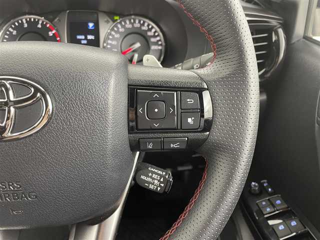 トヨタ ハイラックス Z GRスポーツ 福岡県 2023(令5)年 1万km スーパーホワイトⅡ ワンオーナー　/純正８型ナビ　/全方位カメラ　/純正ベッドライナー　/トノカバー　/ETC　/前後ドライブレコーダー　/レーダークルコン　/コーナーセンサー　/衝突被害軽減ブレーキ　/レーンキープ　/ヒルディセントコントロール　/パドルシフト　/ハーフレザーシート　/パワーシート