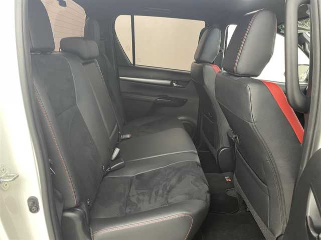 トヨタ ハイラックス Z GRスポーツ 福岡県 2023(令5)年 1万km スーパーホワイトⅡ ワンオーナー　/純正８型ナビ　/全方位カメラ　/純正ベッドライナー　/トノカバー　/ETC　/前後ドライブレコーダー　/レーダークルコン　/コーナーセンサー　/衝突被害軽減ブレーキ　/レーンキープ　/ヒルディセントコントロール　/パドルシフト　/ハーフレザーシート　/パワーシート