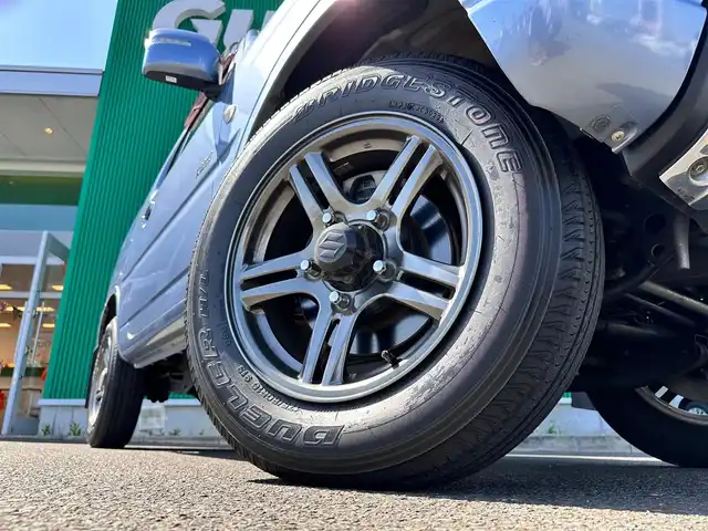 スズキ ジムニー クロスアドベンチャー 宮城県 2013(平25)年 7万km ブリーズブルーメタリック 4WD/社外オーディオ/合皮シート/D席シートヒーター/社外GPSレーダー/純正16インチAW/背面タイヤ/フォグライト/フロアマット/キーレス/ETC