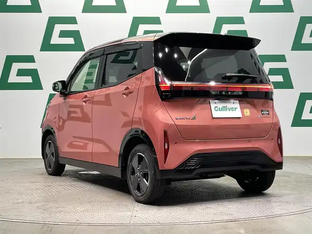 日産 サクラ X 鹿児島県 2023(令5)年 2.7万km ピンク 禁煙車　/社外ディスプレイオーディオ　/(Bluetooth/DVD/CD)　/バックカメラ/エマージェンシーブレーキ/踏み間違い衝突防止アシスト/車線逸脱防止支援システム/標識検知機能/先行車発進お知らせ/コーナーセンサー　/電動パーキングブレーキ　/オートホールド　/スマートキー　/プッシュスタート　/LEDヘッドライト　/純正アルミホイール/純正フロアマット/カラーコード：X42P59