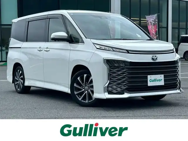 トヨタ ヴォクシー ハイブリッド S－Z 奈良県 2023(令5)年 1.5万km ホワイトパールクリスタルシャイン 純正１０．５インチナビ　/フルセグＴＶ　/BT/CD/DVD/USB/HDMI/両側パワースライドドア　/ワンオーナー　/ハーフレザーシート　/シートヒーター　/追従型クルーズコントロール　/全方位カメラ　/ＬＥＤヘッドライト　/オートライト/オートマチックハイビーム/前後コーナーセンサー/トヨタセーフティーセンス/スマートキー/純正17インチアルミホイール/純正フロアマット/AUTOHOLD