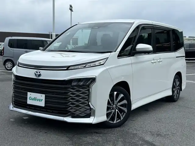 トヨタ ヴォクシー ハイブリッド S－Z 奈良県 2023(令5)年 1.5万km ホワイトパールクリスタルシャイン 純正１０．５インチナビ　/フルセグＴＶ　/BT/CD/DVD/USB/HDMI/両側パワースライドドア　/ワンオーナー　/ハーフレザーシート　/シートヒーター　/追従型クルーズコントロール　/全方位カメラ　/ＬＥＤヘッドライト　/オートライト/オートマチックハイビーム/前後コーナーセンサー/トヨタセーフティーセンス/スマートキー/純正17インチアルミホイール/純正フロアマット/AUTOHOLD