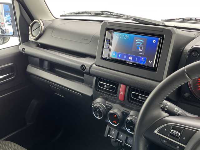 スズキ ジムニー シエラ JC 長野県 2019(平31)年 3.7万km ジャングルグリーン 4WD/5速MT/社外ディスプレイオーディオ(PVH-9300DVSZS)/クルーズコントロール/車線逸脱警報/衝突軽減ブレーキ/ダウンヒルアシストコントロール/前席シートヒーター/ステアリングスイッチ/ビルトインETC2.0/LEDヘッドライト/オートライト/フロントフォグランプ/電動格納ミラー/ウィンカーミラー/ドアミラーヒーター/純正15インチAW装着/純正ドアバイザー/プッシュスタート/スマートキー