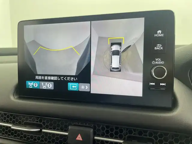 ホンダ ＺＲ－Ｖ ハイブリッド e:HEV Z 三重県 2023(令5)年 2.9万km プラチナホワイトパール Honda SENSING/●衝突軽減ブレーキ（CMBS）/●先行車発進お知らせ機能/●歩行者事故低減ステアリング/●路外逸脱抑制機能/●標識認識機能/●渋滞追従機能付アダプティブクルーズコントロール（ACC）/●車線維持支援システム（LKAS）/●トラフィックジャムアシスト（渋滞運転支援機能）/●ブラインドスポットインフォメーション/●誤発進抑制機能/●後方誤発進抑制機能/●近距離衝突軽減ブレーキ/●パーキングセンサーシステム/●後退出庫サポ―と/●アダプティブドライビングビーム/マルチビューカメラシステム/9型Honda CONNECTディスプレー/・ナビ/フルセグ/BT/スマホ連携/USB/ETC2.0車載器/ワイヤレス充電器/前後ドラレコ（DRH-224SD）/本革シート/D/Nパワーシート/運転席＆助手席シートヒーター/BOSEプレミアムサウンドシステム(12スピーカー)/ハンズフリーアクセスパワーテールゲート(予約クローズ機能付)/18インチアルミホイール(切削＋ベルリナブラック)/注：BSI後退出庫サポートレス
