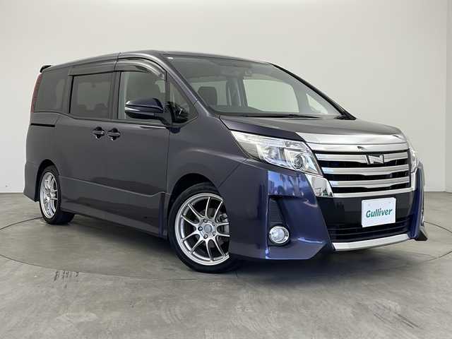 トヨタ ノア Si 兵庫県 2015(平27)年 5.4万km ダークバイオレットマイカメタリック ・ワンオーナー車/・カロッツェリアナビ&TV&BT&CD&DVD/・カロッツェリアフリップダウンモニター/・両側パワースライドドア/・前後ドライブレコーダー/・ビルトインETC/・バックカメラ/・社外18インチアルミホイール/・純正フロアマット/・アイドリングストップ/・LEDライト/・インテリアイルミネーション/・横滑り防止/・アイドリングストップ/・スペアキー