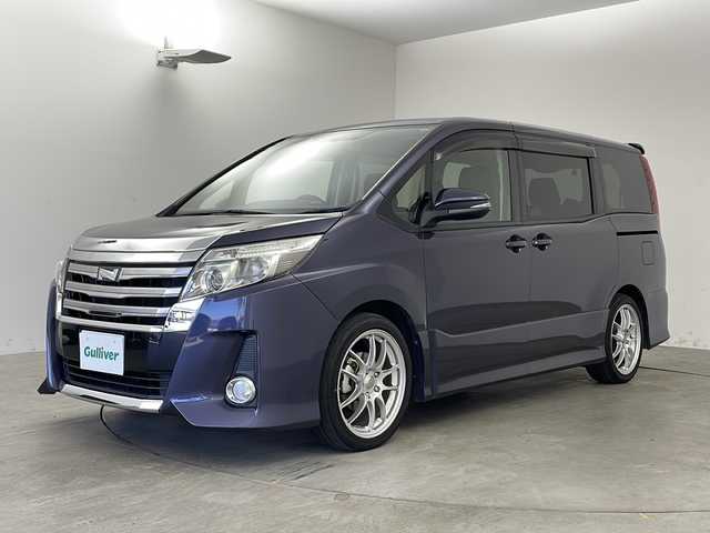 トヨタ ノア Si 兵庫県 2015(平27)年 5.4万km ダークバイオレットマイカメタリック ・ワンオーナー車/・カロッツェリアナビ&TV&BT&CD&DVD/・カロッツェリアフリップダウンモニター/・両側パワースライドドア/・前後ドライブレコーダー/・ビルトインETC/・バックカメラ/・社外18インチアルミホイール/・純正フロアマット/・アイドリングストップ/・LEDライト/・インテリアイルミネーション/・横滑り防止/・アイドリングストップ/・スペアキー