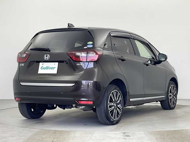 ホンダ フィット e:HEVリュクス 秋田県 2020(令2)年 4.9万km プレミアムグラマラスブロンズP 4WD/純正ナビ/(FM/AM/フルセグTV/Bluetooth/CD/DCD)/バックカメラ/ハーフレザーシート/ホンダセンシング/衝突軽減装置/レーンキープアシスト/コーナーセンサー/クルーズコントロール/横滑り防止装置/アイドリングストップ/オートブレーキホールド/ワイパーデアイサー/ビルトインETC/ドライブレコーダー/ステアリングリモコン/前席シートヒーター/ドアミラーヒーター/ステアリングヒーター/LEDヘッドライト/フォグランプ/オートライト/置くだけ充電/純正アルミホイール/純正フロアマット/プッシュスタート/スマートキー