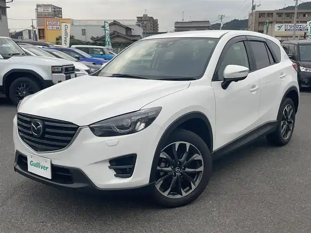 マツダ ＣＸ－５ 25S Lパッケージ 広島県 2015(平27)年 2.5万km クリスタルホワイトパールマイカ ワンオーナー/メモリナビ/（Bluetooth/USB/CD/DVD/AUX）/バックカメラ/アイドリングストップ/クルーズコントロール（追従有）/ドアバイザー/プッシュスタート/ビルドインETC/LEDヘッドライト/衝突軽減ブレーキ/レーンキープアシスト
