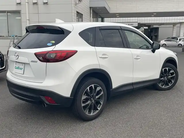 マツダ ＣＸ－５ 25S Lパッケージ 広島県 2015(平27)年 2.5万km クリスタルホワイトパールマイカ ワンオーナー/メモリナビ/（Bluetooth/USB/CD/DVD/AUX）/バックカメラ/アイドリングストップ/クルーズコントロール（追従有）/ドアバイザー/プッシュスタート/ビルドインETC/LEDヘッドライト/衝突軽減ブレーキ/レーンキープアシスト