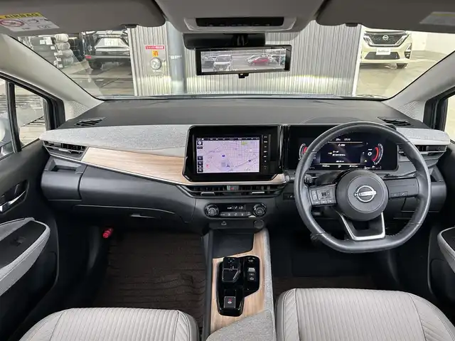 日産 オーラ G レザーエディション 愛知県 2024(令6)年 0.7万km グレー ・禁煙車　/・純正ナビMM223D-L（フルセグ・ＢＴ・ＵＳＢ）/・全周囲カメラ　/・ＥＴＣ　/・前後クリアランスソナー　/・インテリジェントエマージェンシーブレーキ/・踏み間違い防止　/・車線逸脱防止支援システム　/・車線逸脱警報/・ふらつき警報　/・標識認識機能/・後側方衝突防止支援システム/・後側方車両検知警報/・後退車両検知警報/・オートマチックハイビーム/・ブラインドスポットモニター/・横滑り防止/・デジタルインナーミラー/・オートライト/・LEDヘッドライト/・フォグライト/・スマートキー/・プッシュスタート