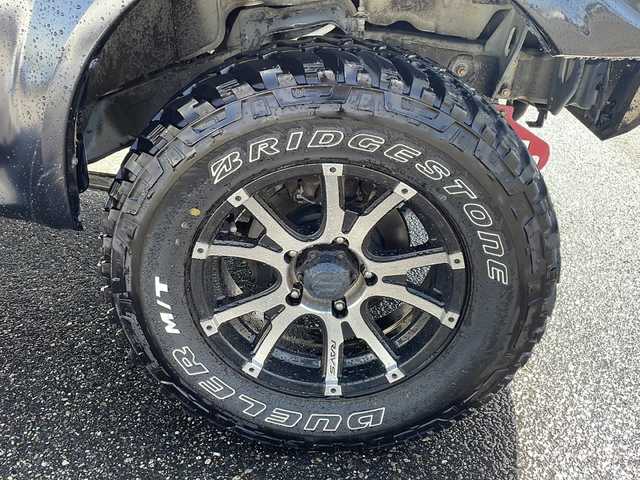 スズキ ジムニー シエラ クロスアドベンチャー 新潟県 2014(平26)年 16.4万km ブルーイッシュブラックパール3 ４WD/リフトアップ/センターデフロック/社外ナビ〈strada CN-R300D〉/フルセグTV/純正エアロパーツ〈フロント＆サイド〉/社外アルミ〈RAYS１６インチAW〉/社外マフラー〈K3〉/社外テールランプ/専用シート/バックカメラ/フォグランプ/ウィンカーミラー