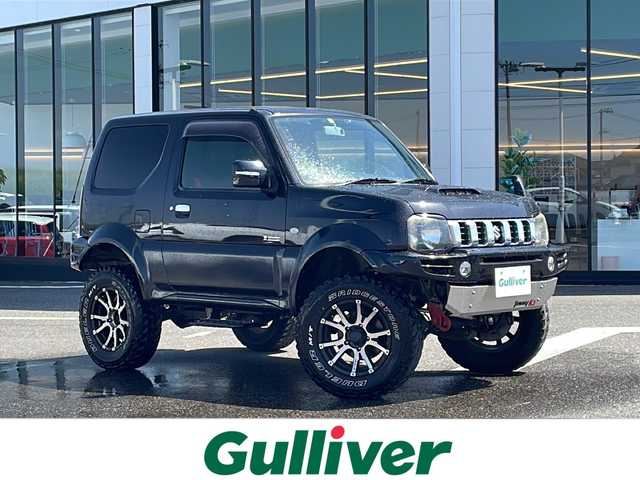 スズキ ジムニー シエラ クロスアドベンチャー 新潟県 2014(平26)年 16.4万km ブルーイッシュブラックパール3 ４WD/リフトアップ/センターデフロック/社外ナビ〈strada CN-R300D〉/フルセグTV/純正エアロパーツ〈フロント＆サイド〉/社外アルミ〈RAYS１６インチAW〉/社外マフラー〈K3〉/社外テールランプ/専用シート/バックカメラ/フォグランプ/ウィンカーミラー