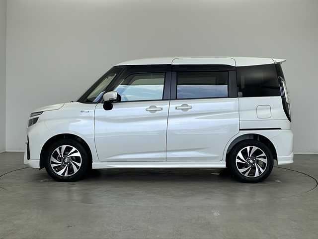 スズキ ソリオ バンディット HV MV 新潟県 2022(令4)年 3.9万km ピュアホワイトP 純正９インチメモリナビ（Bluetooth・USB・AM・FM）/両側パワースライドドア　/アラウンドビューモニター　/ヘッドアップディスプレイ　/フルセグ　/ETC２．０　/衝突被害軽減システム/レーンキープアシスト　/後方コーナーセンサー　/追従クルーズコントロール/LEDオートライト/オートマチックハイビーム/フォグランプ/前後ドラレコ/アイドリングストップ/リアサーキュレーター/スマートキー/純正フロアマット/純正１５インチアルミホイール