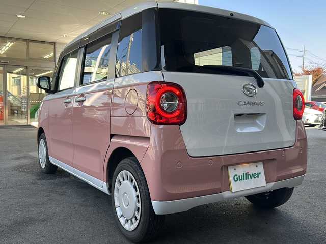 ダイハツ ムーヴ キャンバス ストライプス X 大分県 2023(令5)年 1.5万km シャイニングホワイトパール/アプリコットピンクメタリック ワンオーナー /9インチ純正SDナビ /フルセグTV /CD/DVD再生機能/バックカメラ /両側パワースライドドア /禁煙　/クリアランスソナー /2トーン /前方純正ドライブレコーダー /電動格納ミラー　/スマートキー/Wエアバッグ/オートライト